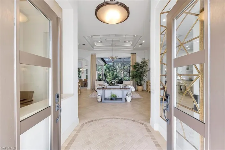 Lovely Foyer with beautiful front doors