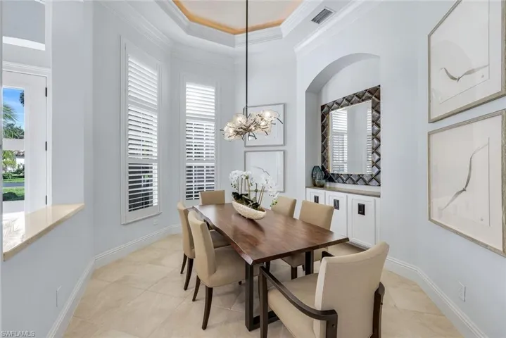 Formal dining is an open format and has convenient access to the kitchen with built in storage