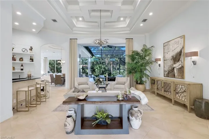 Open for entertaining at the counter height wet bar. Fabulous ceiling designs and great paint colors
