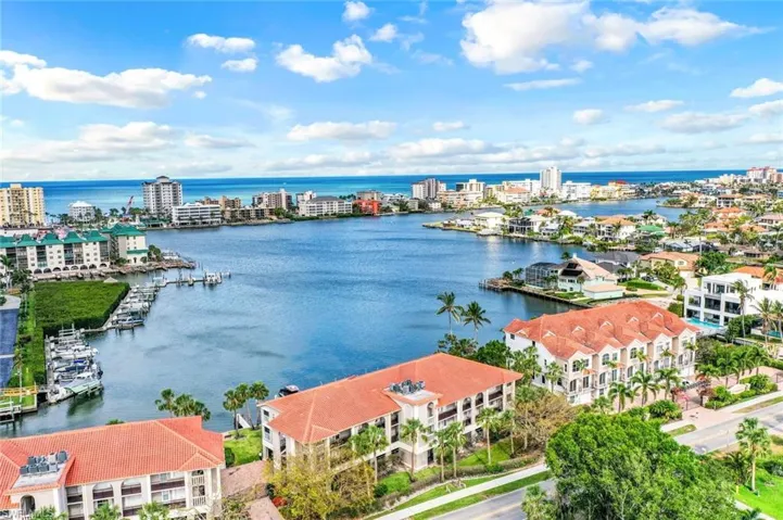 View of urban area featuring a large body of water and apartment complex