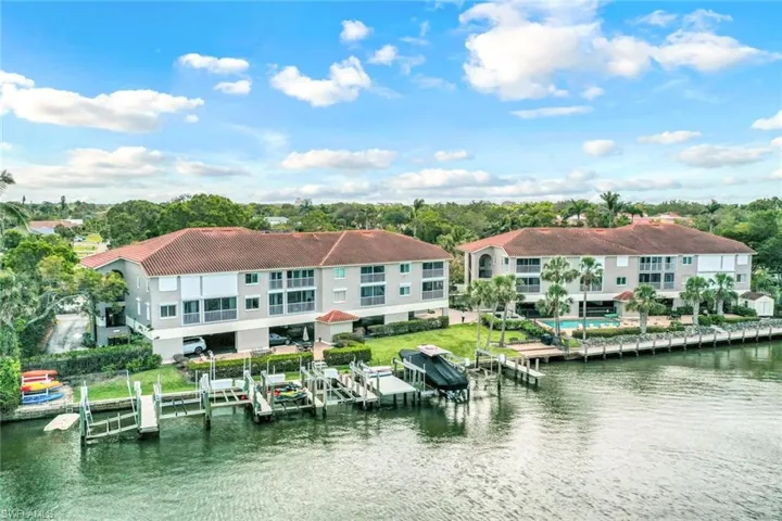 Water view with a boat dock and boat lift