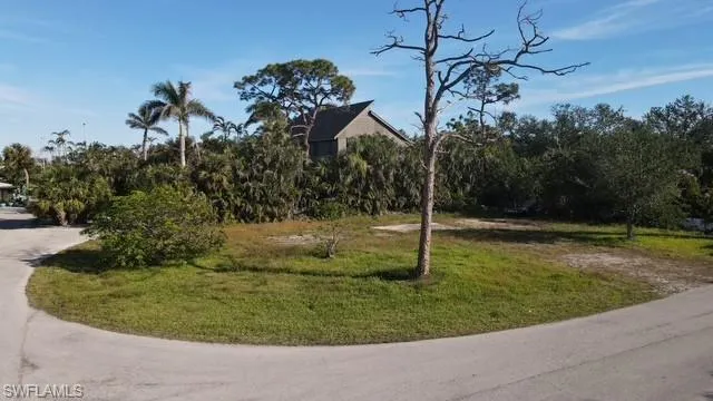 View of property's community featuring a lawn