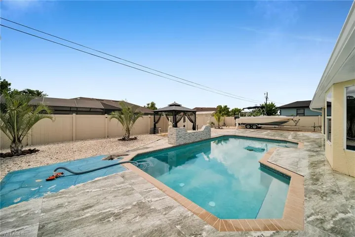View of pool featuring a patio and a gazebo