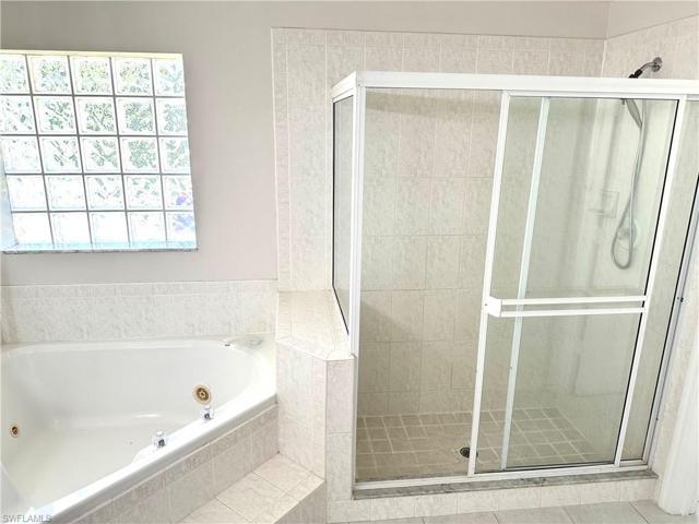 Separate shower stall and tub