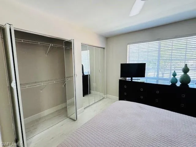Wall to Wall Closet with custom mirror doors