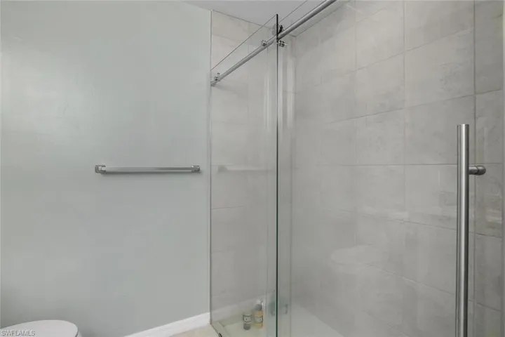 Primary Bathroom with toilet and walk in shower