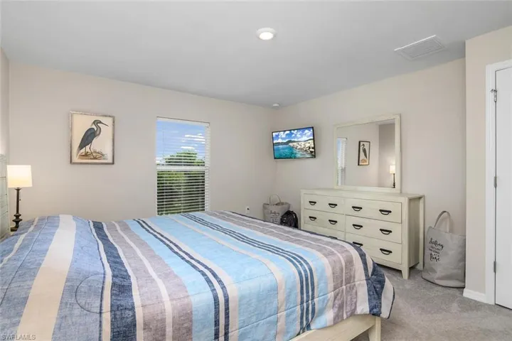 Primary carpeted bedroom