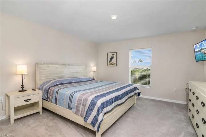 Primary carpeted bedroom