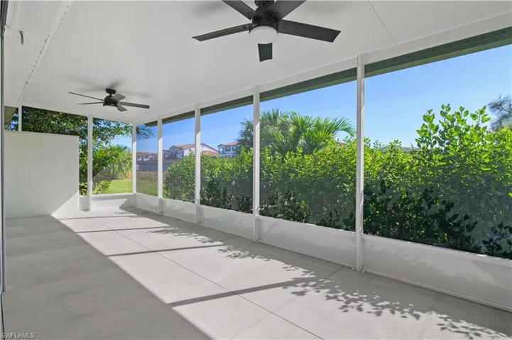 Unfurnished sunroom with a ceiling fan