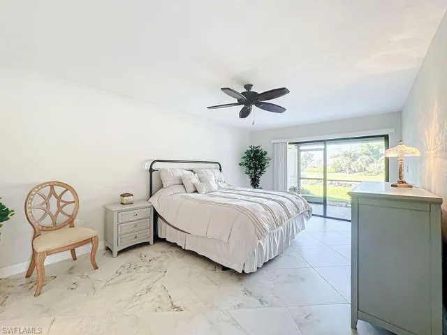 Bedroom with ceiling fan and access to exterior