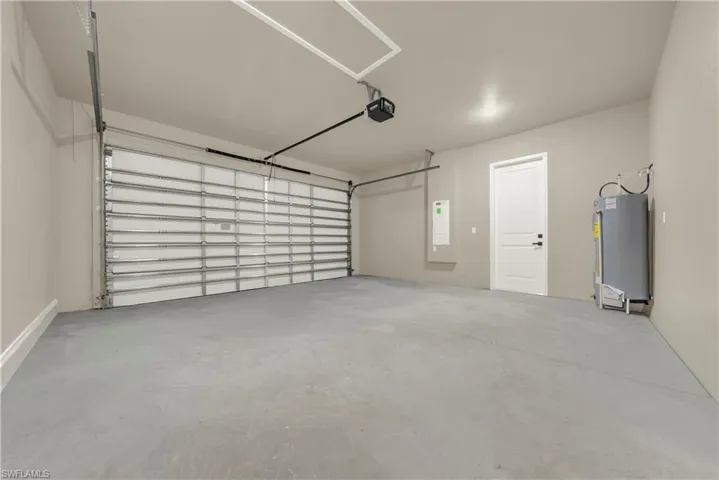 Garage featuring water heater