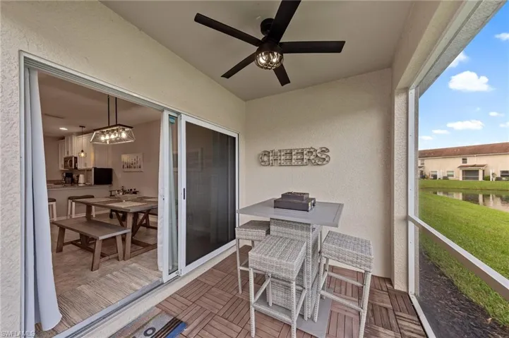 Balcony featuring a ceiling fan and outdoor dining space
