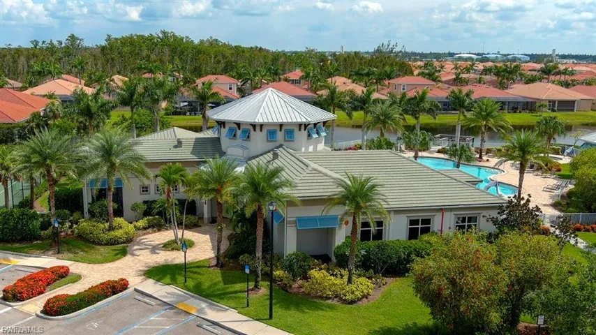 Aerial view of residential area featuring a pool area