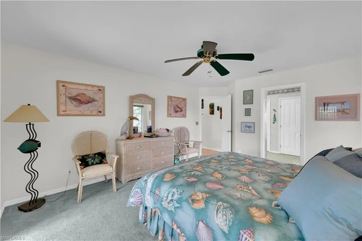 Bedroom with carpet flooring and a ceiling fan