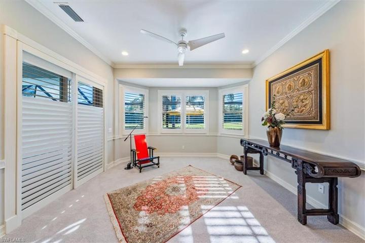 Master bedroom sitting area facing golf course