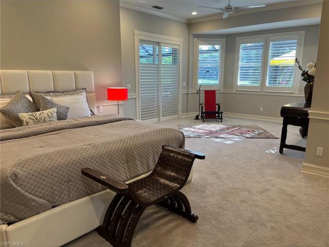large master bed w/sitting area w/view to golf course