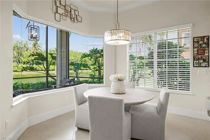 dining space featuring a wealth of natural light and ornamental molding