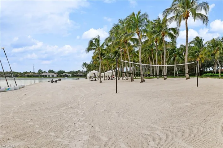 Beach  with volleyball court and covered cabanas
