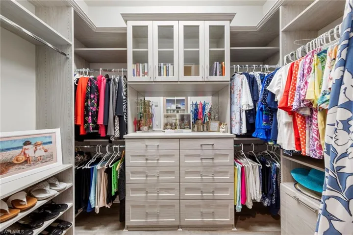 Both primary bedroom closets professionally designed.
