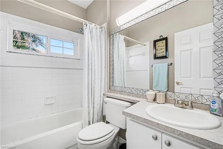 Full bathroom with vanity and shower / bath combo