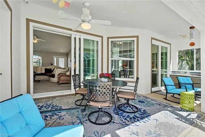 View of patio / terrace with ceiling fan and outdoor seating