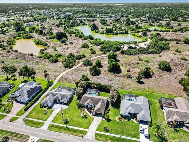 Aerial view of residential area featuring a large body of water