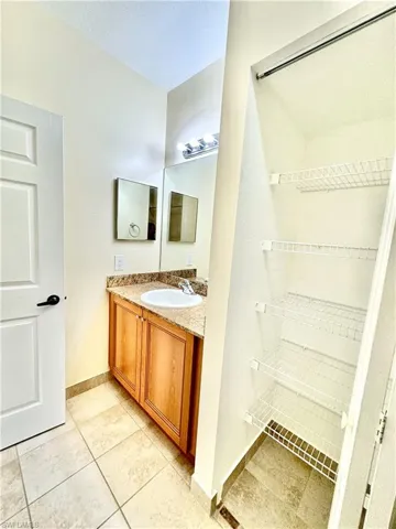Guest Bath Vanity Open Linen Closet View