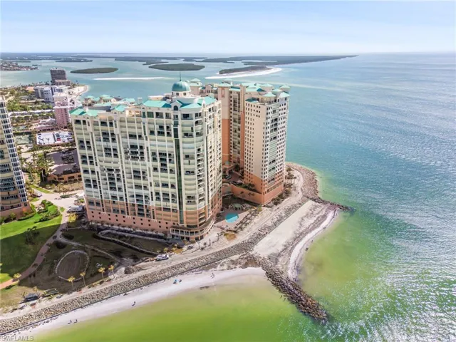 Drone / aerial view featuring a water view and a beach view
