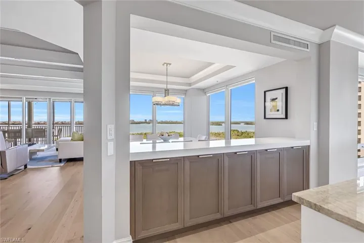 Dual-sided island cabinetry enhances both form and function.