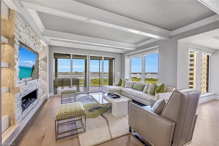 The large great room offers floor to ceiling windows with so much gathering space forfriends and family.