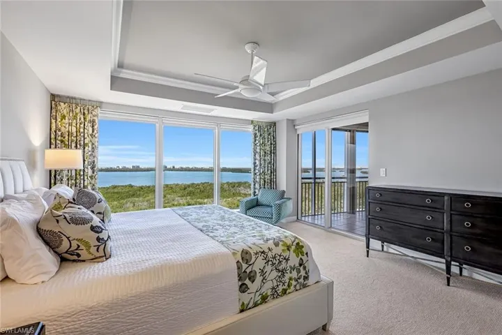 Tranquil bedroom featuring beautiful water vistas.