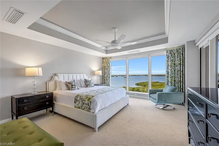 After a day at the beach club or on the golf course, this serene primary suite offers the perfect place to recharge.