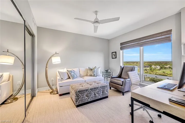 The second guest bedroom, currently styled as an office, highlights the versatility of the space.