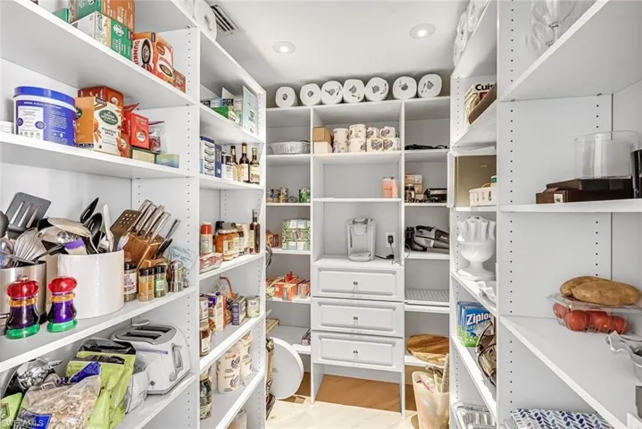 A large pantry adds valuable storage and keeps the kitchen feeling organized, and effortlessly functional.