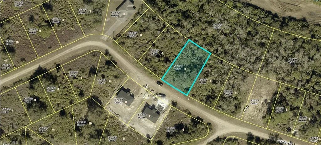 Aerial map of property and surrounding area featuring property parcel outlined