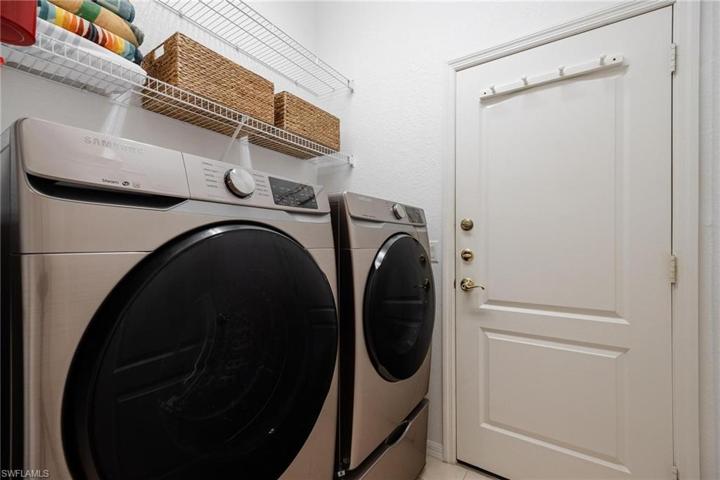 Laundry room is accessible from Kitchen with exit to the 2 car garage. New Samsung washer & Dryer.