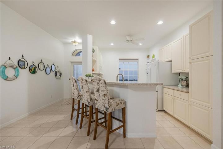 Large kitchen with breakfast bar, built-in pantry on right and could accomodate "Eat-in" area.