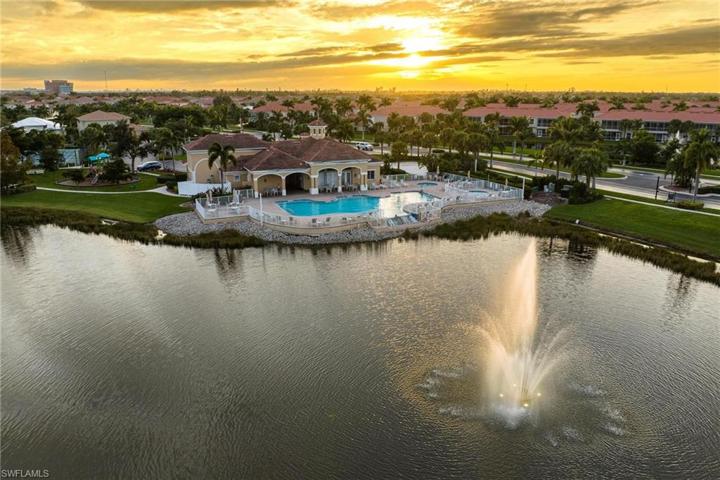 A mature neighborhood with beautiful palm trees. View of the incredible clubhouse and community ammenities.