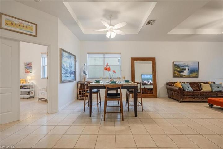 As you enter the home to an open floor plan - Dining area is open to main living room. Den/Bedroom 3 is on the left. Trey ceilings in both the dining and living room.