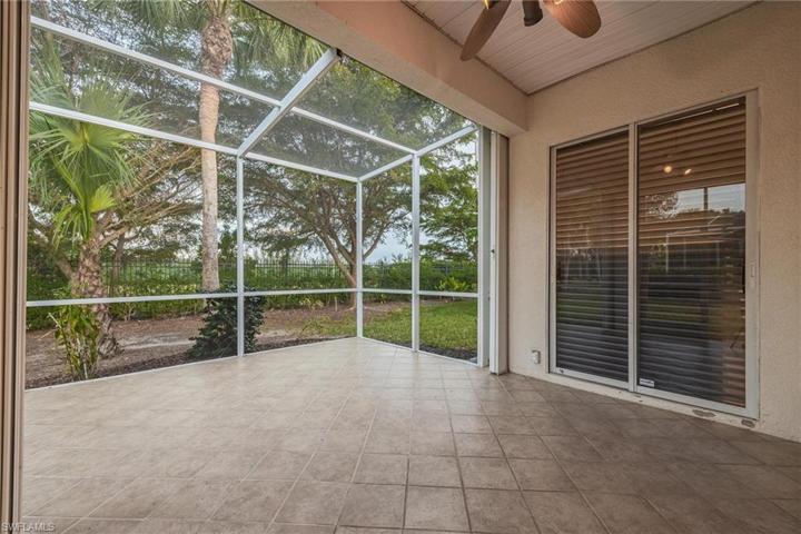 Extra large out door space - covered lanai with accordion style shutters. Sliding doors here are from the main bedroom.