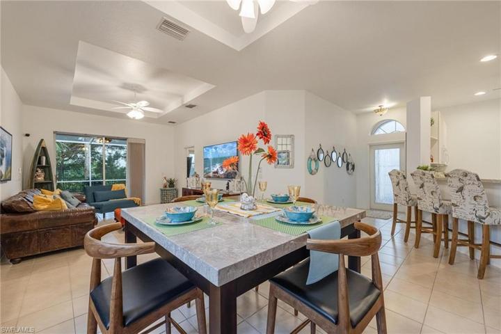 Kitchen is off to the right with full breakfast bar for easy entertainment