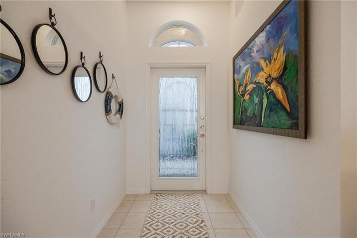 Beautiful full glass door as you enter the foyer hallway.
