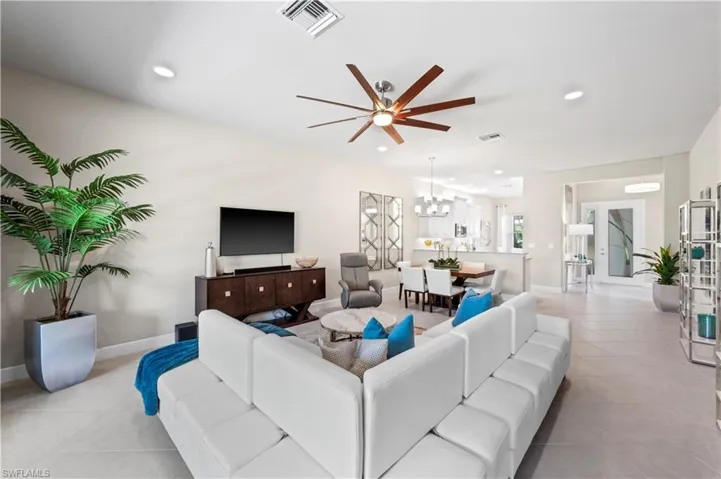 Tiled living room with ceiling fan