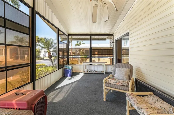 Sunroom featuring plenty of natural light and ceiling fan