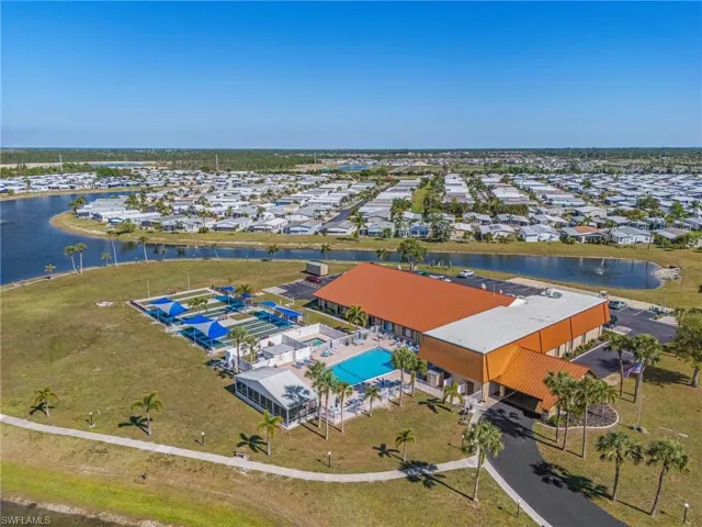 Drone / aerial view featuring a water view and a residential view