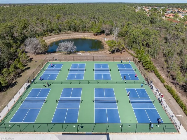 Aerial view of a heavily wooded area and a large body of water
