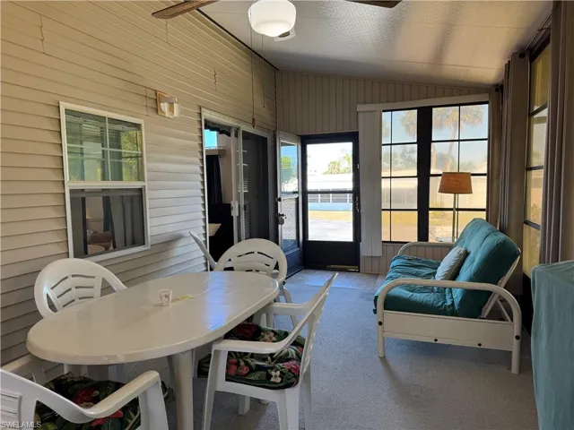 Sunroom / solarium with lofted ceiling