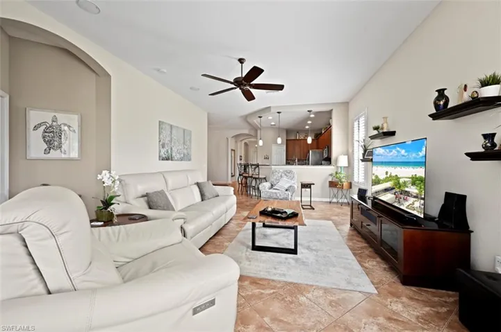 Tiled living room with ceiling fan