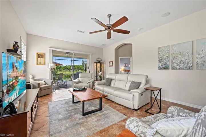 Tiled living room with ceiling fan