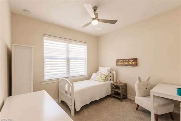 Bedroom featuring carpet floors and ceiling fan